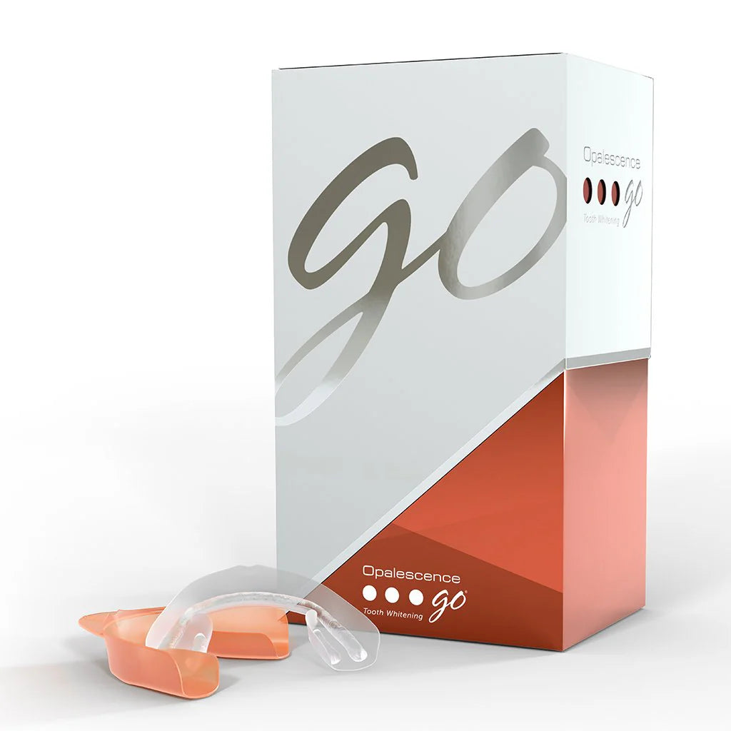 Home teeth whitening kit featuring Opalescence Go 6% Melon, including pre-filled trays for easy application.