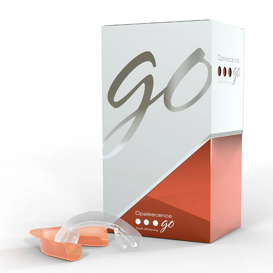 Home teeth whitening kit featuring Opalescence Go 6% Melon, including pre-filled trays for easy application.